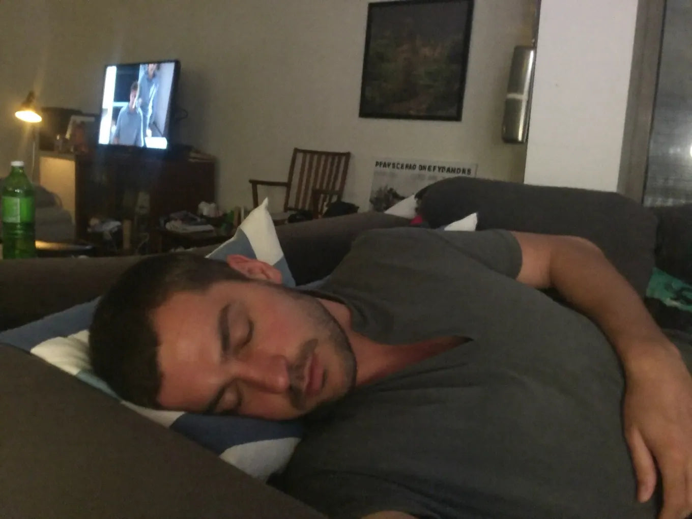 Man collapsed on the couch after work